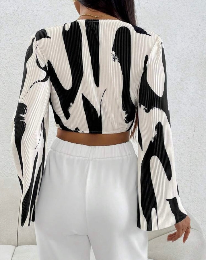 Blusa estampada, tela plisada